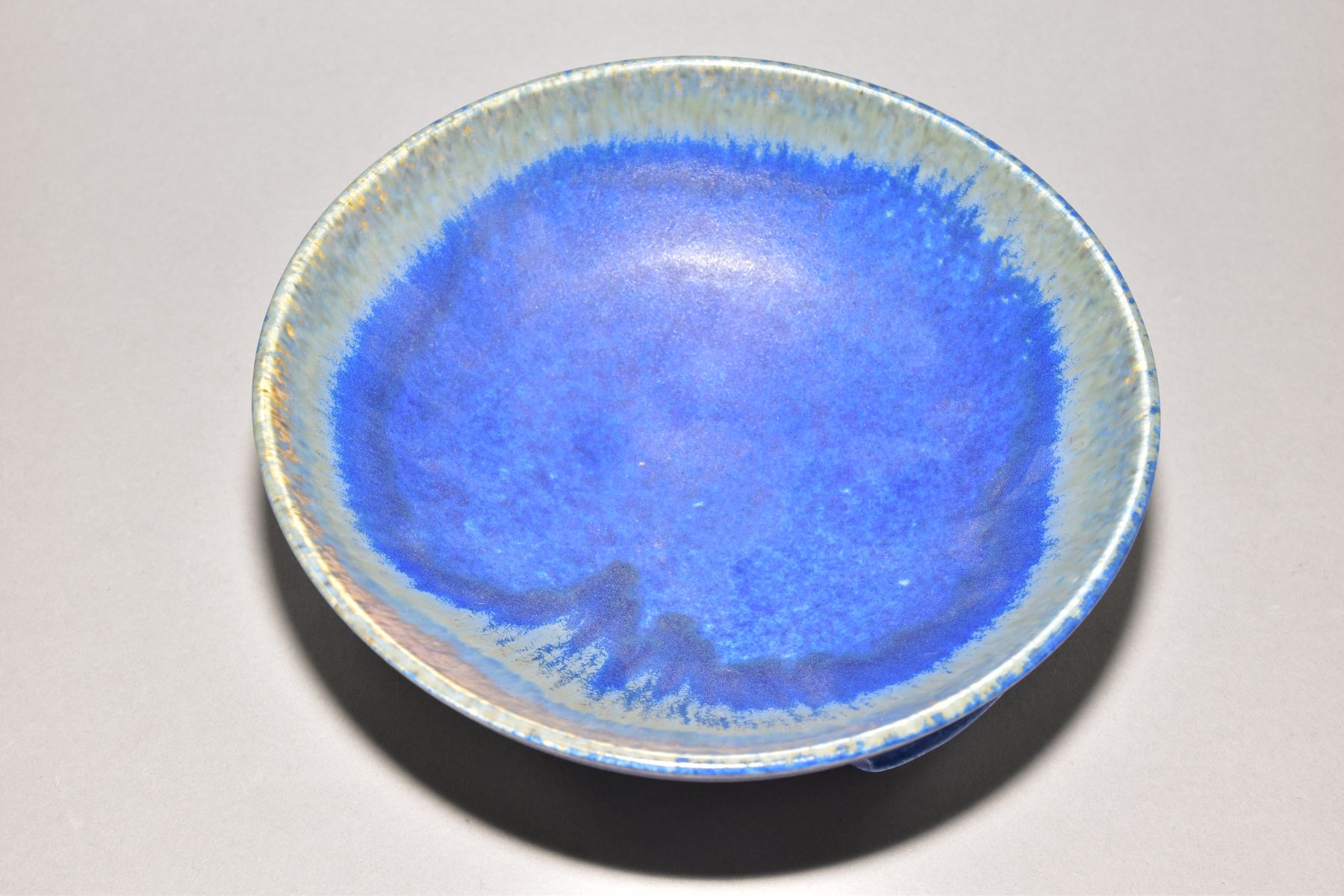 RUSKIN POTTERY a bowl raised on three feet, blue crystalline glaze to the inside surface, - Image 3 of 5