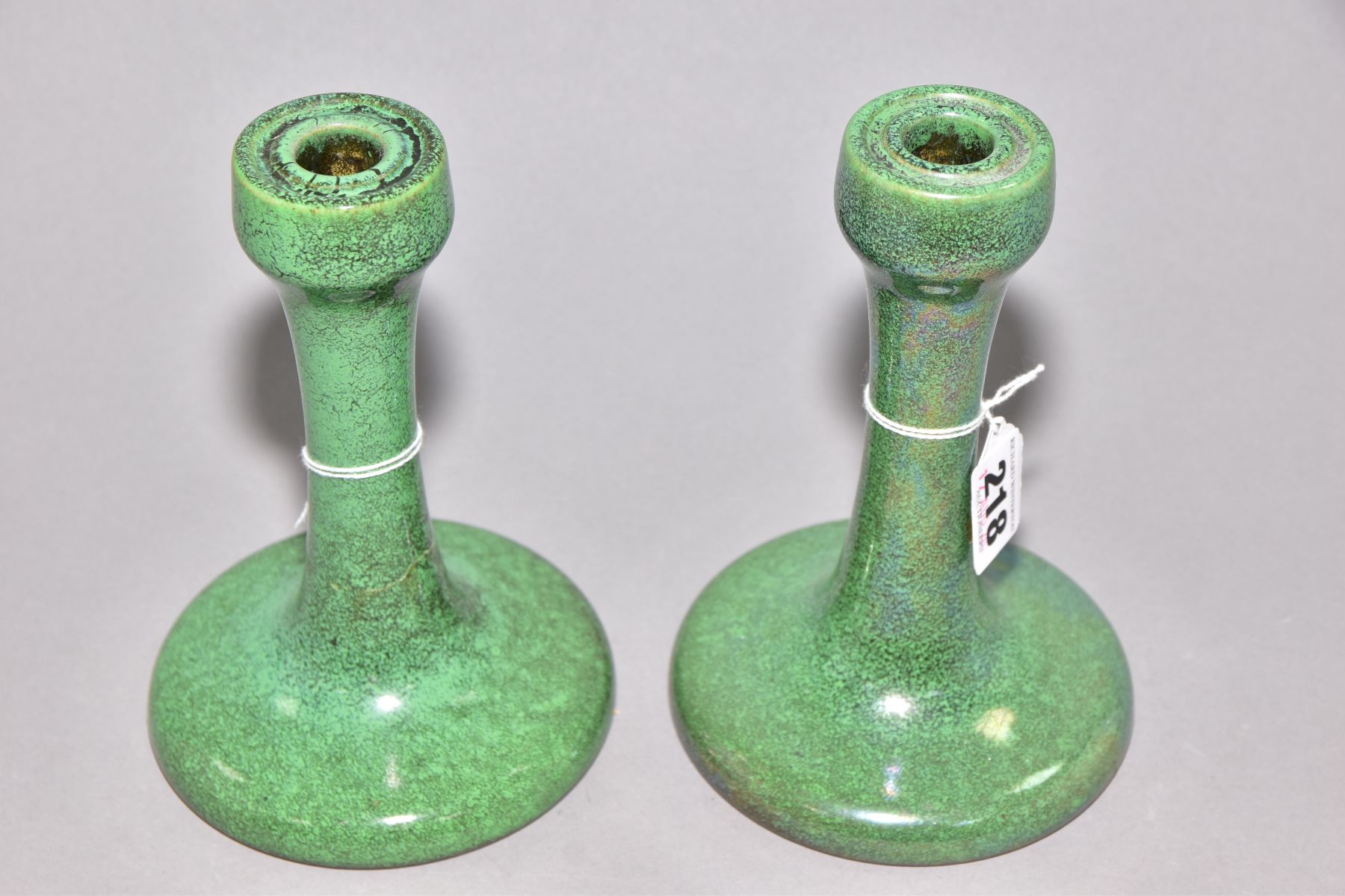 RUSKIN POTTERY, a pair of candlesticks covered in green tea dust glaze, inscribed Ruskin England - Image 2 of 5