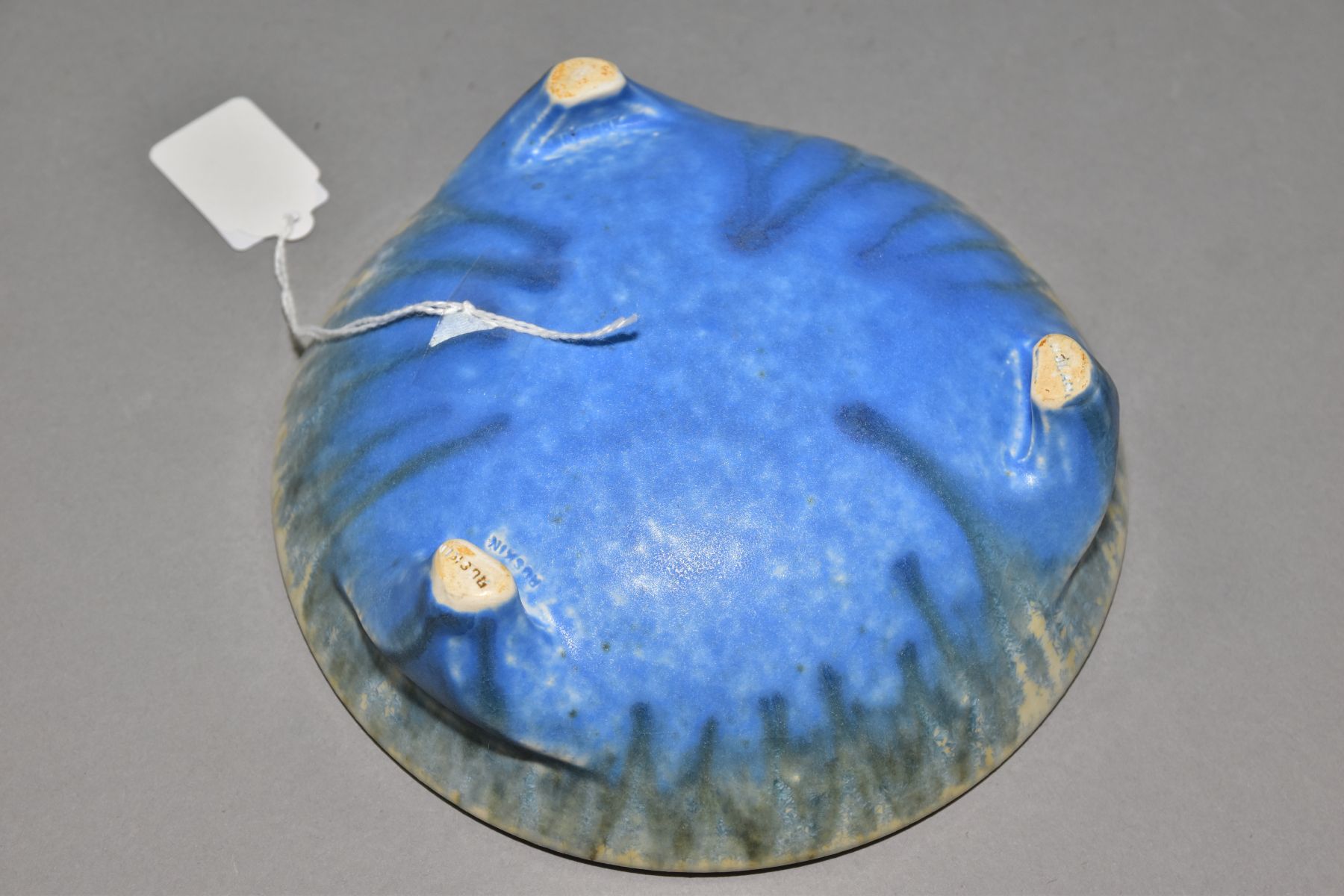 RUSKIN POTTERY, a shallow bowl raised on three feet, blue and orange crystalline glaze over white - Image 4 of 4