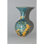 A SIMON RICH (BORN 1949) STUDIO POTTERY CRYSTALLINE GLAZED BOTTLE VASE, wide flared rim, ochre