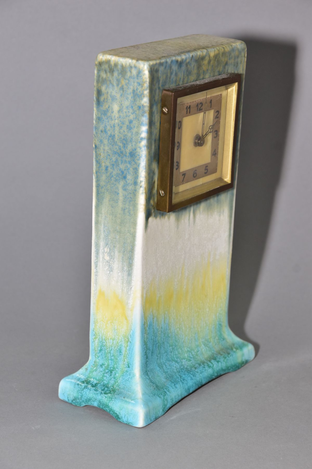 RUSKIN POTTERY, a rectangular clock case with flared base, matt green fading to white and yellow, - Image 3 of 5