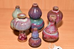 SIX MINIATURE CHINESE STYLE VASES including meiping and double gourd shapes, mottled glazes,