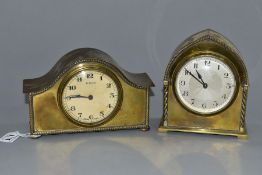 TWO EARLY 20TH CENTURY BRASS CASED MANTEL CLOCKS, one domed, the other arched, both with Arabic