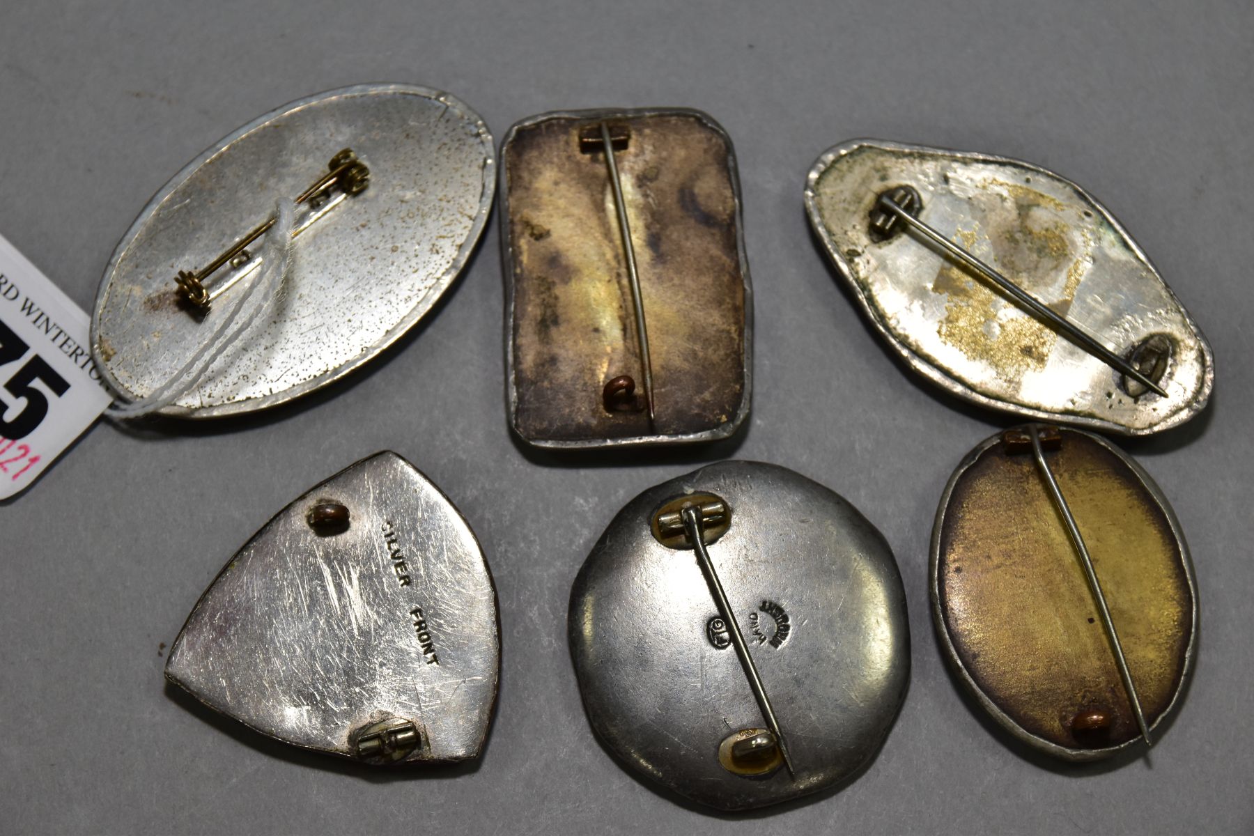 SIX RUSKIN STYLE BROOCHES, five enamels set into pewter, one stamped FTG hand wrought, one enamel - Image 3 of 3