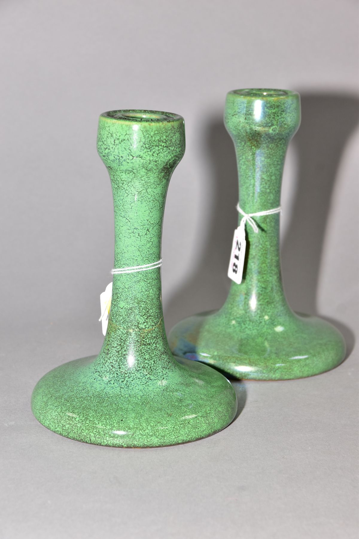 RUSKIN POTTERY, a pair of candlesticks covered in green tea dust glaze, inscribed Ruskin England - Image 4 of 5