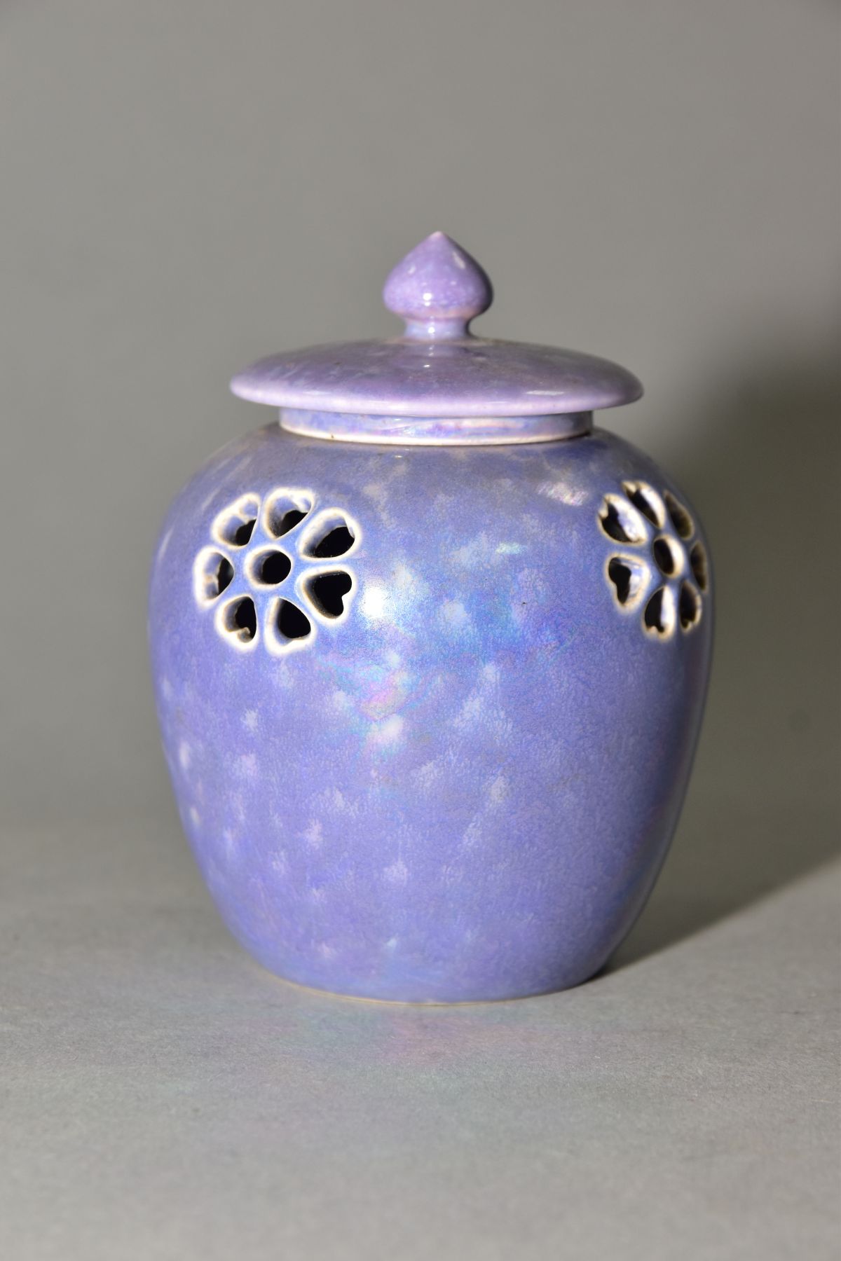 RUSKIN POTTERY, a lavender lustre reticulated ginger/pot pourri jar with cover, pierced flowers with