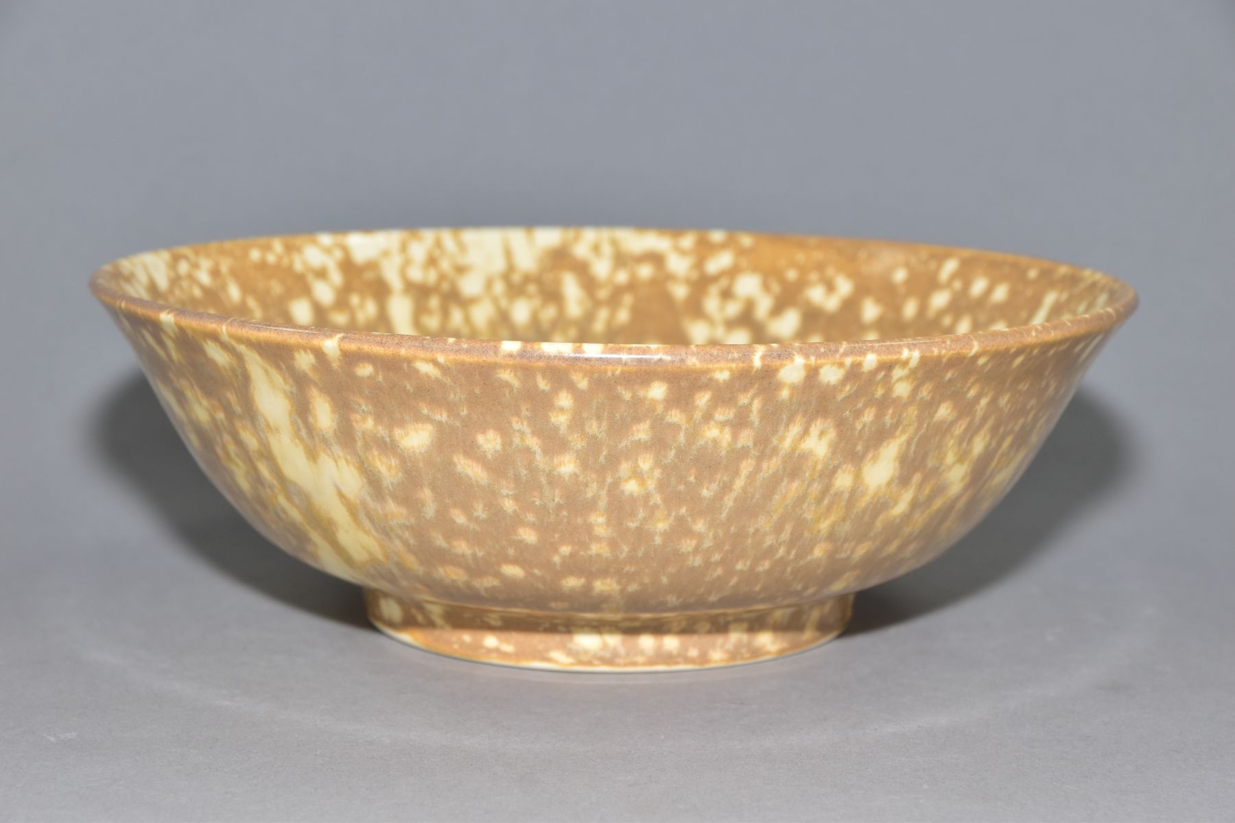 RUSKIN POTTERY, a brown and cream mottled glaze bowl, impressed Ruskin England to the base, height