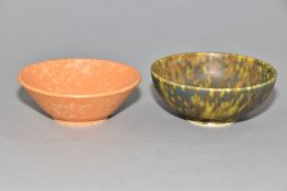 RUSKIN POTTERY, two footed bowls of mottled glazes, the first is orange and is impressed Ruskin