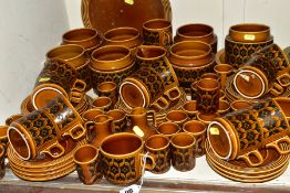 A QUANTITY OF HORNSEA HEIRLOOM PATTERN BROWN GLAZED WARES, including seven storage jars (all lacking