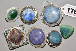 SEVEN RUSKIN & RUSKIN STYLE BROOCHES, comprising two open backed examples marked Ruskin, one mount