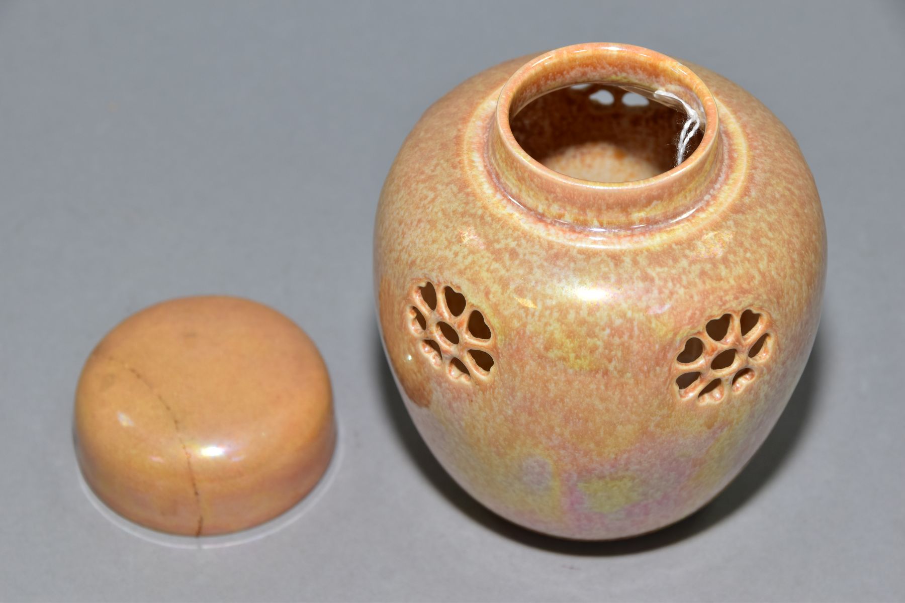RUSKIN POTTERY, a peach lustre reticulated ginger/pot pourri jar with cover, the body pierced with - Image 4 of 6
