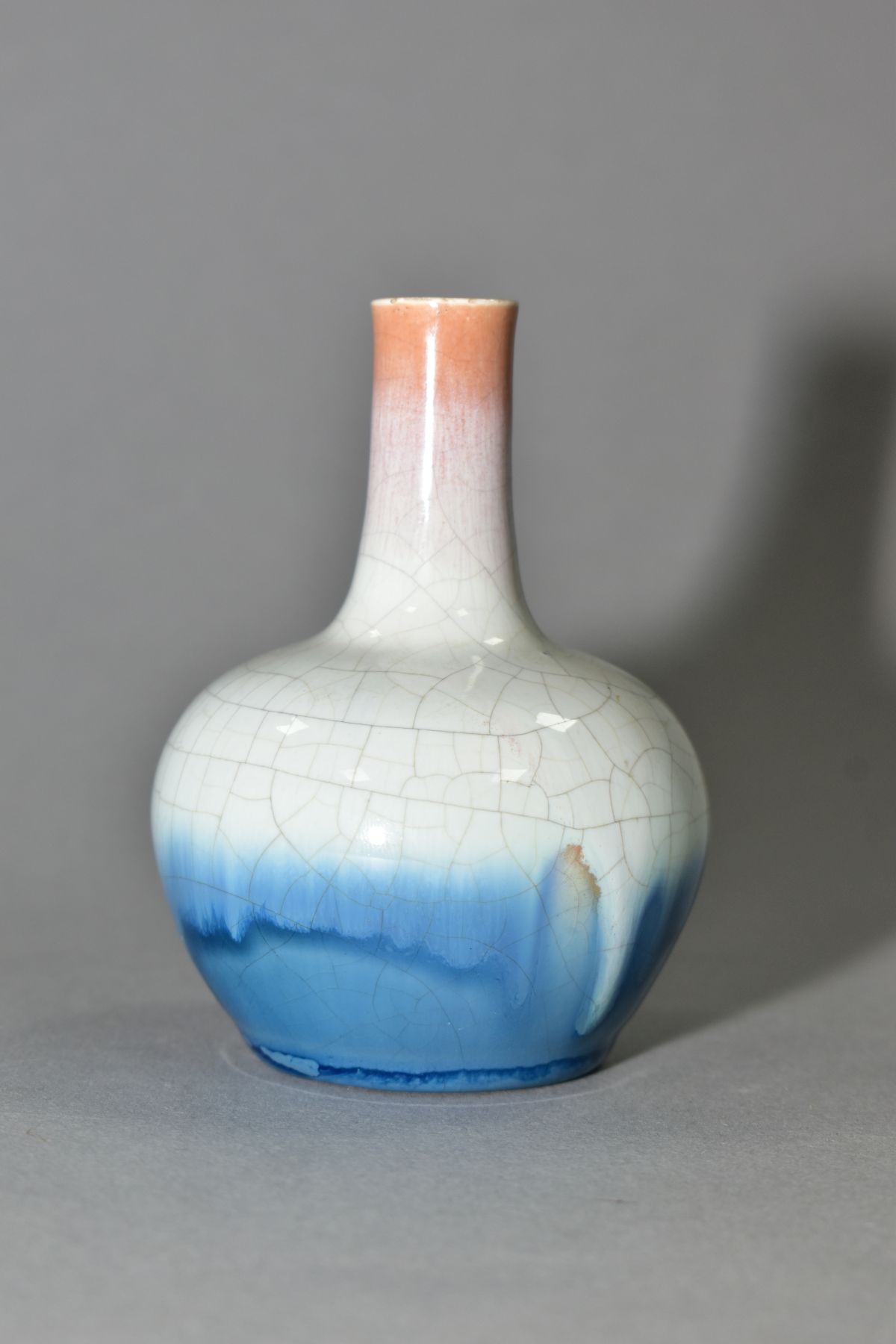 A MALLET SHAPED POTTERY VASE, crackle glaze fading from buff to blue, possibly by the Ashby Guild,