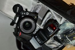 A NIKON D700 DIGITAL SLR CAMERA fitted with a Nikkor AF 28-80mm f3.3 lens, a SB800 flash and a