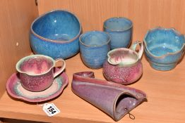 EIGHT PIECES OF STUDIO POTTERY, comprising a tea cup and saucer, matching milk jug, wall pocket,