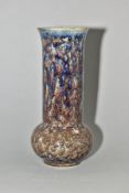 A COBRIDGE STONEWARE HIGH FIRED BULBOUS VASE WITH ELONGATED CYLINDRICAL NECK, mottled brown blue