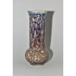 A COBRIDGE STONEWARE HIGH FIRED BULBOUS VASE WITH ELONGATED CYLINDRICAL NECK, mottled brown blue