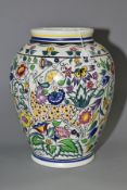 A LARGE POOLE POTTERY PERSIAN DEER PATTERN BALUSTER VASE, bears label for 'Albert. E. Wade