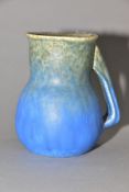 RUSKIN POTTERY, a blue jug of globular to cylindrical form, no spout formed at the rim, impressed