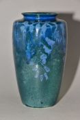 RUSKIN POTTERY, 261 shape vase of high shoulder form, having a dark green mottled glaze with blue