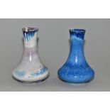 TWO COBRIDGE STONEWARE BALUSTER VASES, both with high fired glazes, one in a mottled blue, the other
