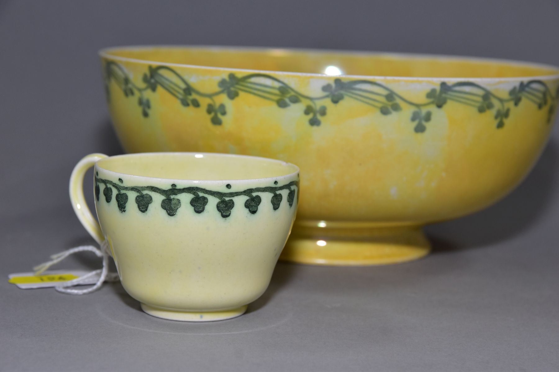 RUSKIN POTTERY, a footed eggshell bowl, covered in a yellow glaze with a band of clover to the outer - Image 3 of 5