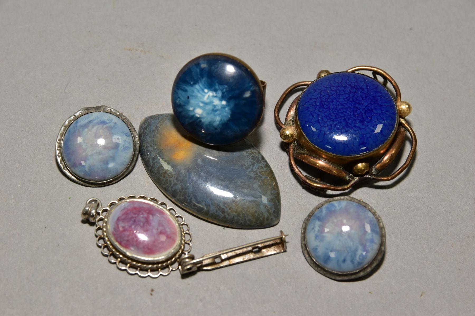 A BOX OF RUSKIN AND RUSKIN STYLE ENAMELS, comprising a ring, a pair of earrings, pendant, a