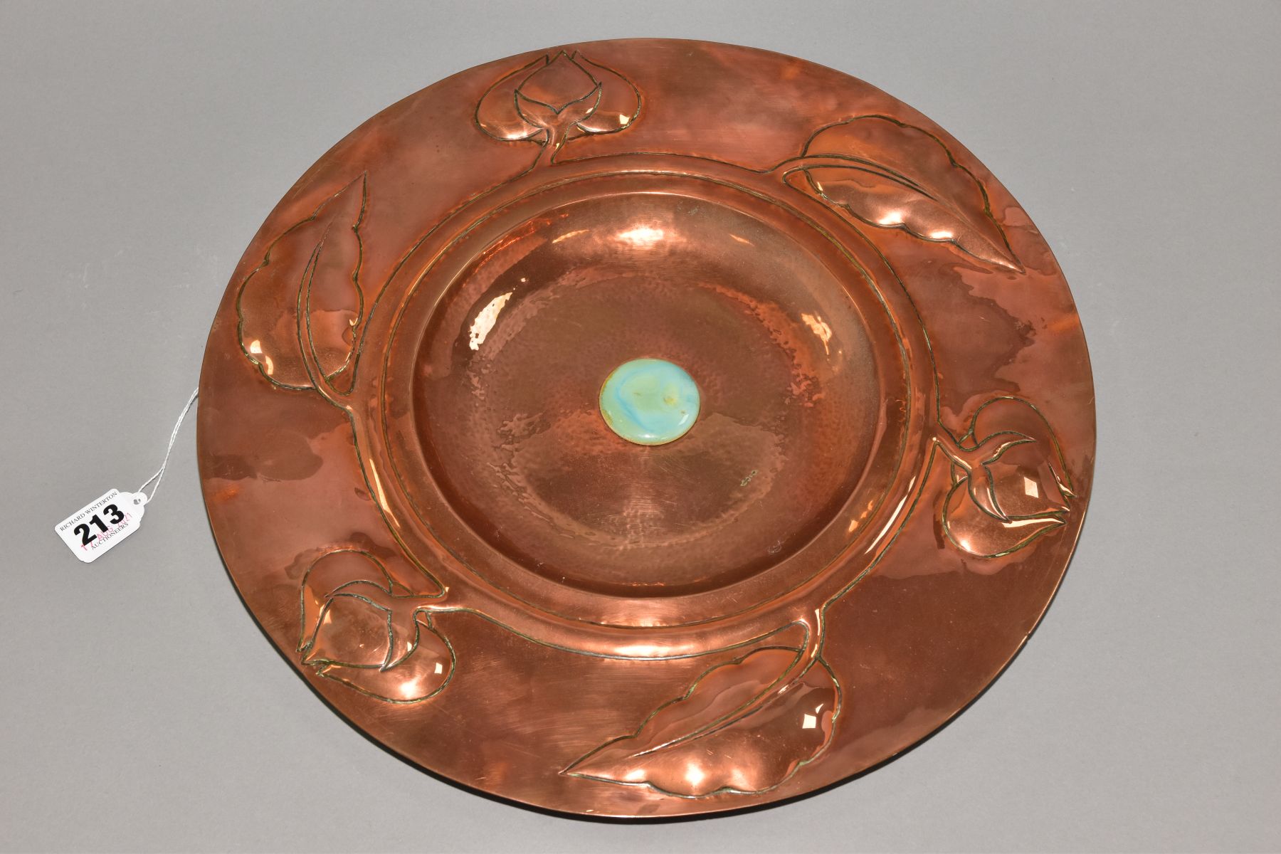 AN ARTS AND CRAFTS STYLE COPPER CHARGER, embossed with a band of foliate motifs, the central - Image 6 of 8