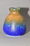 RUSKIN POTTERY, a rounded conical vase, banded with green, orange and blue glazes, impressed