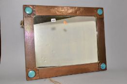 AN ARTS & CRAFT STYLE RECTANGULAR COPPER FRAMED MIRROR, inset with four Ruskin style circular