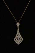 A SILVER GILT DIAMOND SET PENDANT NECKLACE, the pendant of a kite shape set with a single cut and