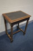 AN EARLY 20TH CENTURY OAK WRITING DESK, with adjustable tilting top, on bobbin turned supports and