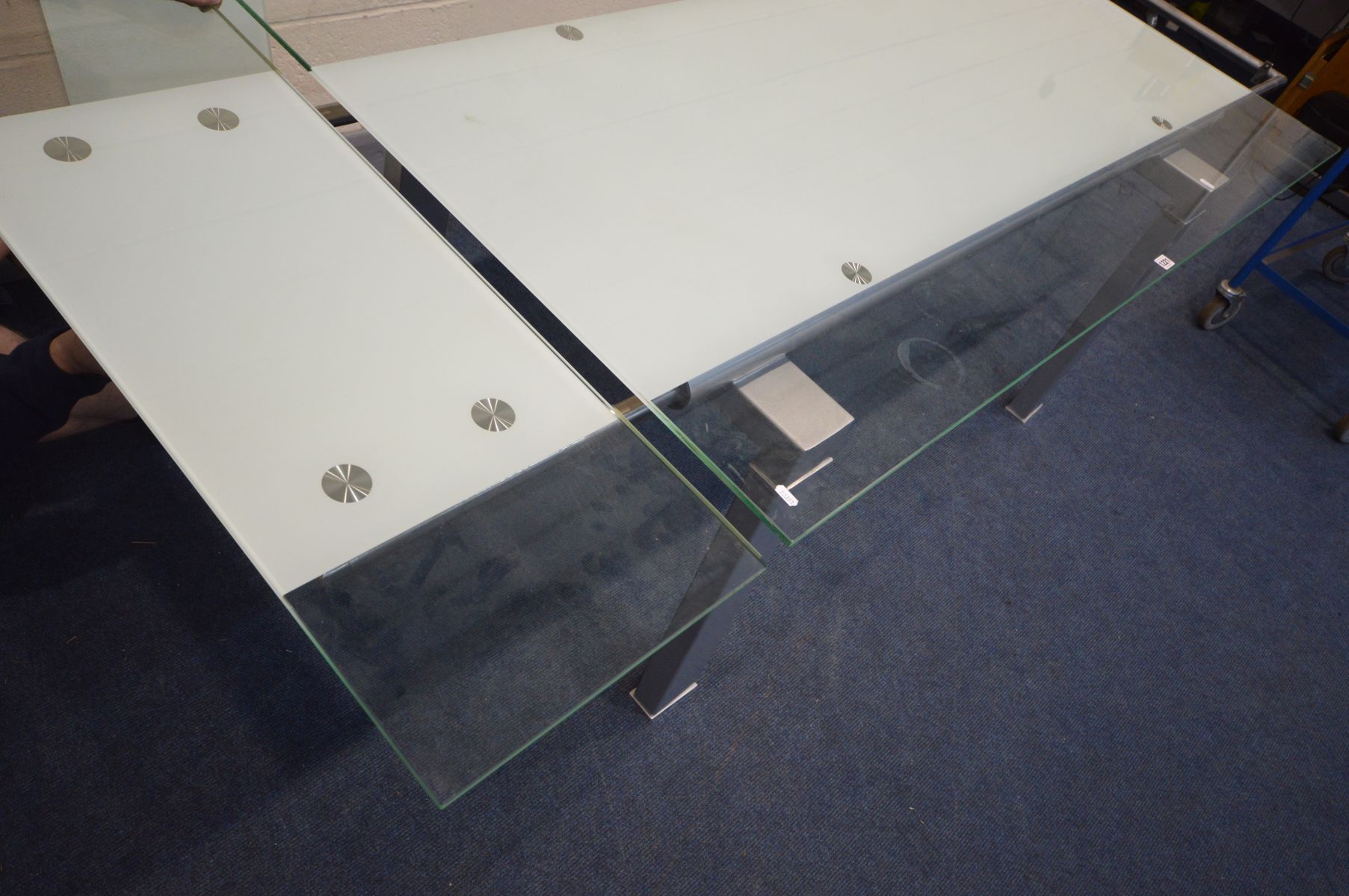 A MODERN GLASS TOP EXTENDING CONFERENCE/DINING ROOM TABLE, on a metal block frame, pull out leaf - Image 6 of 6