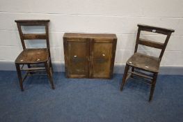 A VINTAGE OAK STORAGE CABINET, the double doors labelled 'ROYAL EDISON MOTOR LAMP BULBS' enclosing