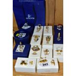 A COLLECTION OF FOURTEEN BOXED SWAROVSKI CRYSTAL MINIATURE ITEMS, comprising nine Crystal Memories