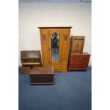 AN EDWARDIAN SATINWOOD SINGLE DOOR WARDROBE (cracks to base), a Victorian stained pine chest of