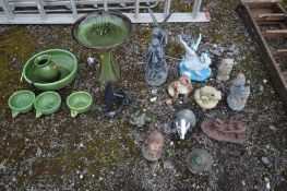 A SELECTION OF GARDEN ORGAMENTS, to include a green glazed bird bath, a five piece glazed water