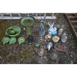 A SELECTION OF GARDEN ORGAMENTS, to include a green glazed bird bath, a five piece glazed water