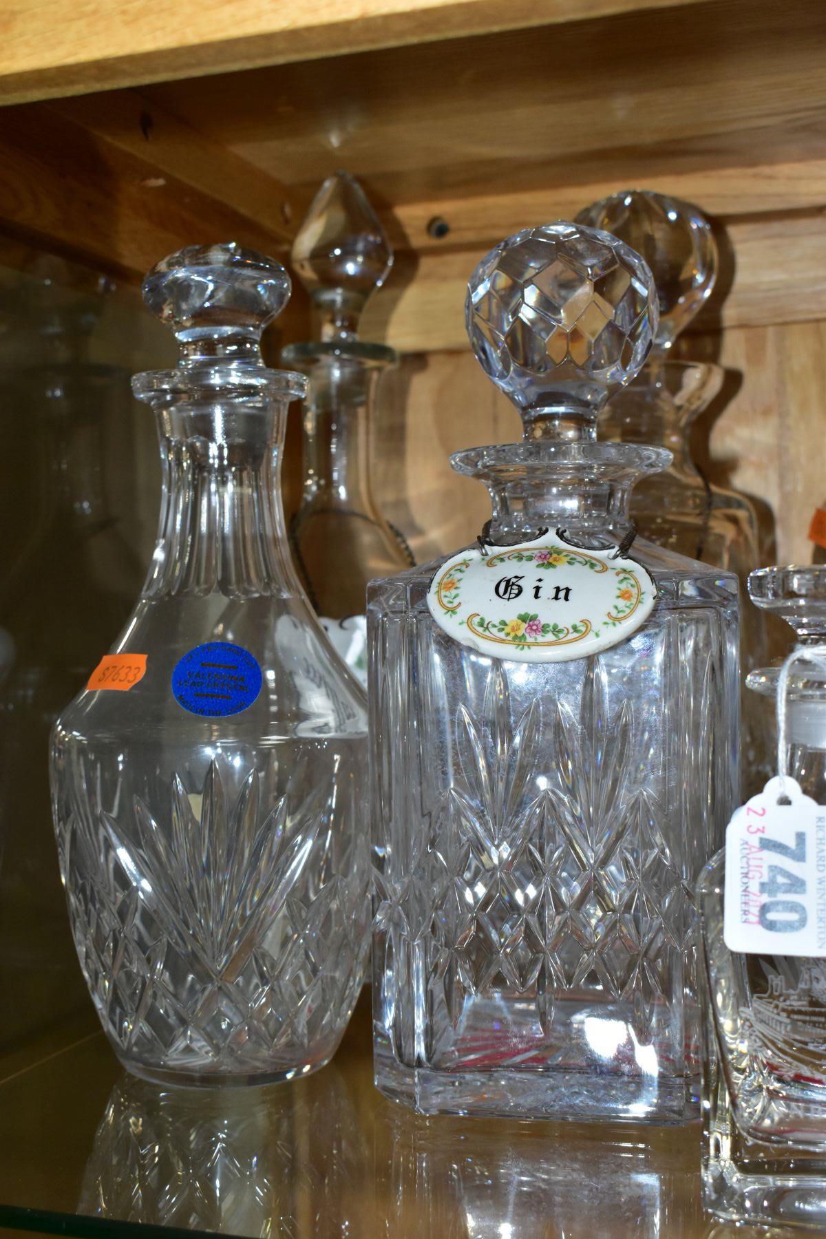 TEN CUT AND PRESSED GLASS DECANTERS AND BOTTLES, five with named porcelain decanter labels, one - Image 4 of 6