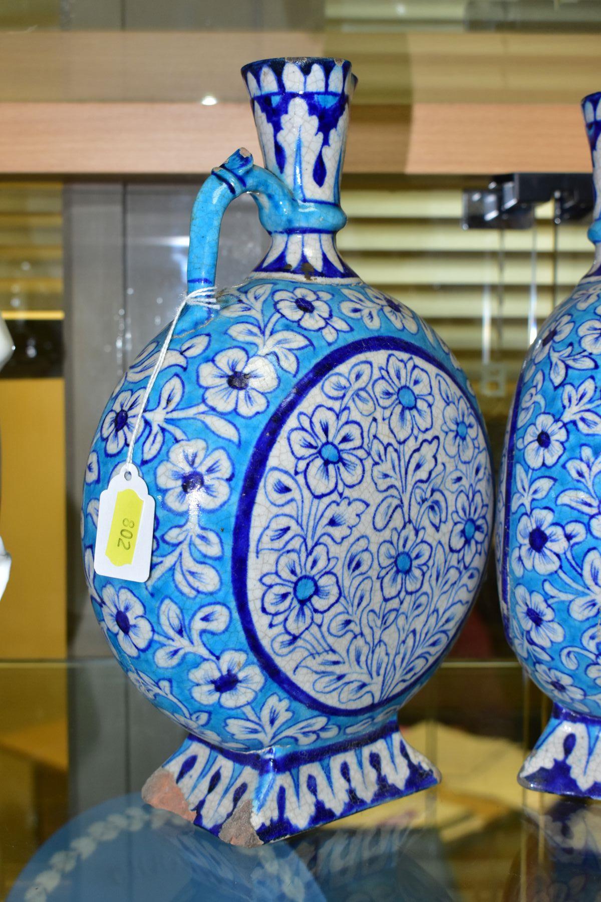 A PAIR OF LATE 19TH/EARLY 20TH CENTURY IZNIK STYLE EWERS, of moon flask form, the turquoise and blue - Image 6 of 8