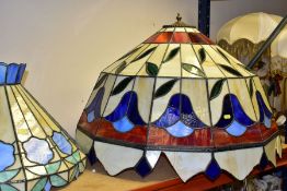 FIVE COLOURED AND LEADED GLASS LIGHT SHADES, various designs, including a pair, most have some