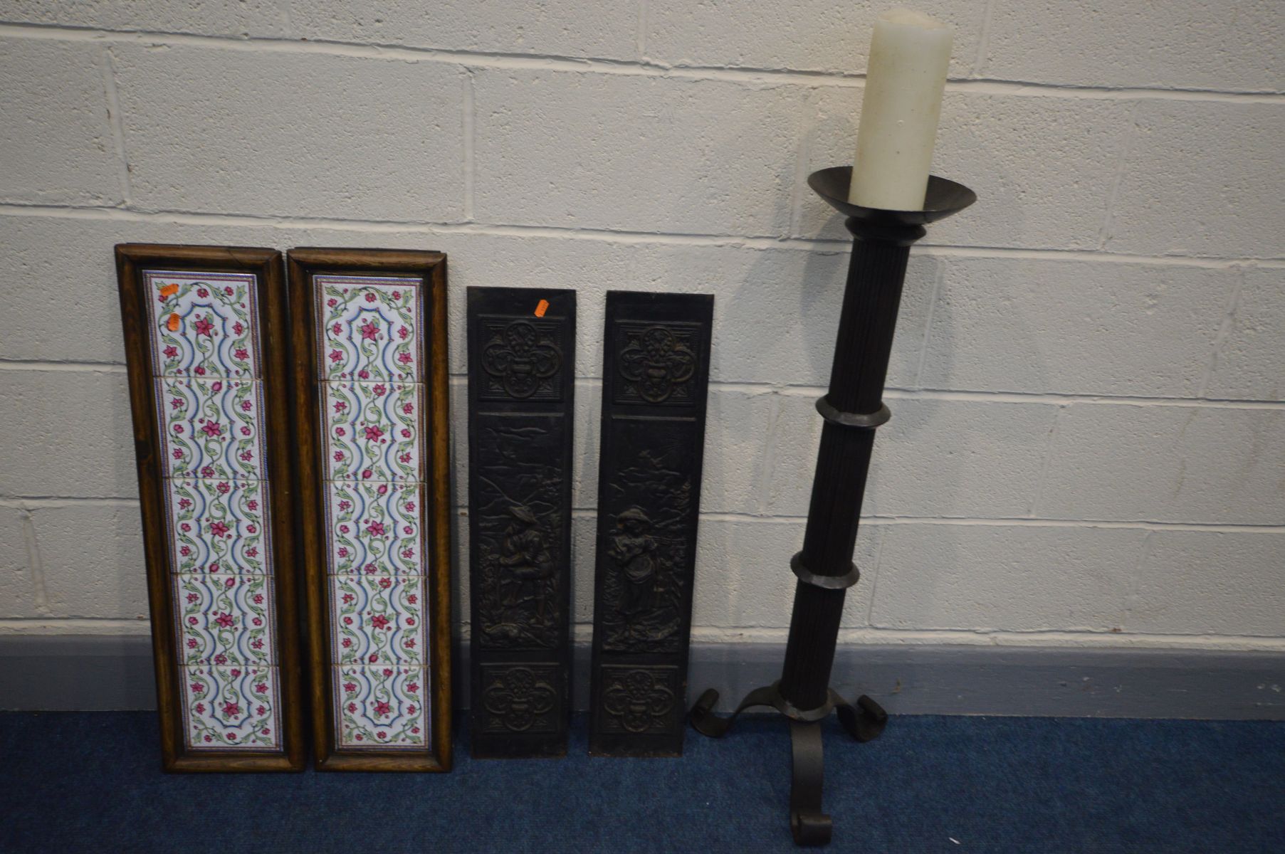 A PAIR OF CAST IRON FIRE PLACE PANELS, pair of tiled fire place panels and a wrought iron candle