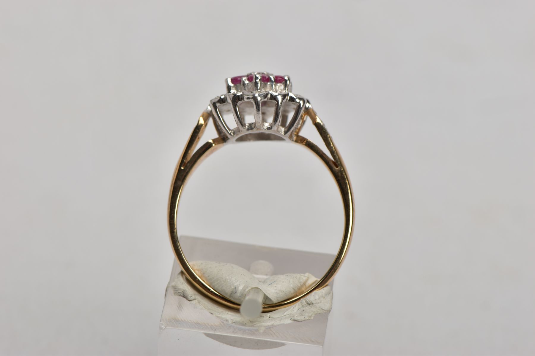 A 9CT GOLD RUBY AND DIAMOND CLUSTER RING, the three tier cluster set with a central single cut - Image 3 of 4