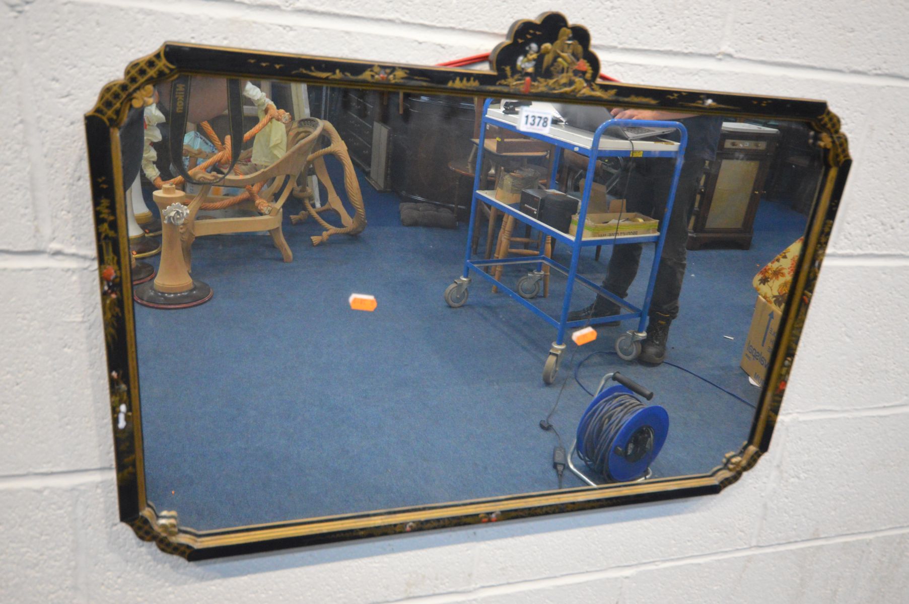 A JAPANNED AND PARCEL GILT WALL MIRROR, with chinoiserie decoration, 80cm x 57cm