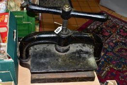 A CAST IRON BOOK PRESS used condition with some paint loss and wear but appears complete and in