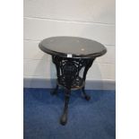 A CIRCULAR PAINTED CAST IRON PUB TABLE, with a stained wooden top, diameter 59cm x height 72cm