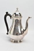 A MID 20TH CENTURY SILVER COFFEE POT, plain polished baluster form, scroll detail the spout,