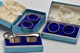 A SINGLE SILVER TEASPOON AND THREE CASED SETS OF NAPKIN RINGS, the teaspoon with a tapered reeded