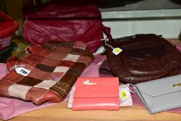 FOUR RADLEY ITEMS AND A GRAFFITI PURSE, comprising 19cm x 32cm red, pink and brown handbag with