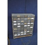 AN INDUSTRIAL WORKSHOP BANK OF FORTY TWO DRAWERS, a metal carcass with plastic drawers, width 90cm