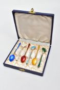 A CASED SET OF SIX GUILLOCHE ENAMELLED TEASPOONS, each with a tapered gilt handle applied bead to